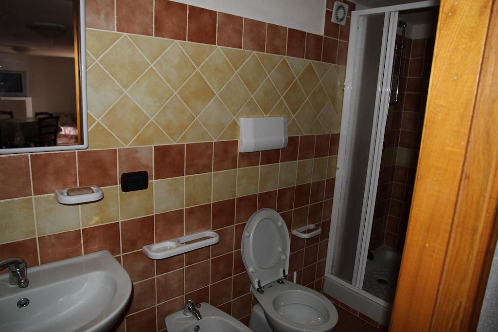 Addisora Appartamenti Cala Liberotto Szoba fotó